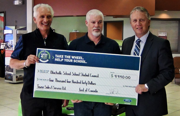 Towne Ford's Terry Hambrook, Blackville School's Tim Grattam and Towne Ford owner Hal Somers