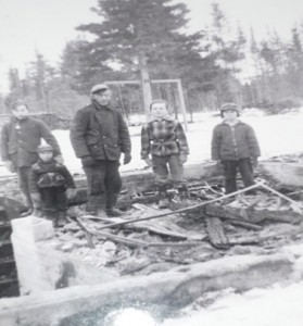 Standing in what is left of our home: Terrence Walls with his hand on Eric Underhill’s shoulder, Jim MacKenzie, Michael McLaughlin, and Dale MacKenzie. You can see our swing tree in the back yard, and a pile of firewood by the back fence.