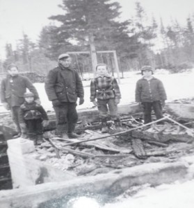 Standing in what is left of our home:  Terrence Walls with his hand on Eric Underhill’s shoulder, Jim MacKenzie, Michael McLaughlin, and Dale MacKenzie.  There’s our swing tree in the back yard.