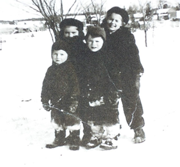 I believe the above picture of the four of us was taken somewhere by the MacCormack house.  Marjorie and Katharine are standing behind me and Johnny.  Smiles all around!