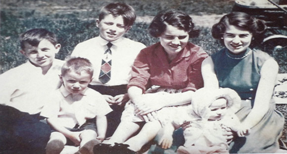 Leslie, sitting in front of Katharine, was just a baby then, at about nine months old. Leonard, sitting in front of me and Johnny, was about three and a half. Respectively, me, Johnny, Marjorie and Katharine were twelve, thirteen, fifteen and seventeen years old.