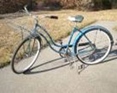 A girl’s bike, with parcel carrier, that looks very much like ours