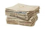 Bundles of newspapers dropped off by the delivery truck