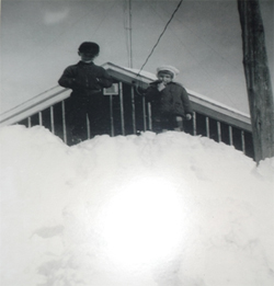 This picture of Leonard and Leslie standing on top of the snow bank in front of our house gives an indication of the amount of snow we got that year.  Note that the house is still unfinished, with just tarpaper strapped to the outside.  Also note the television antenna sticking up from the middle of the house, held erect with wires strung from the corners.