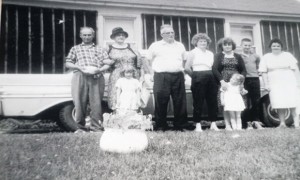 Dad, Granny, Grampa, Mom, Aunt Greta, me, and Aunt Patricia. The two little girls in front are my little sister Leslie, and Aunt Greta’s daughter, Colleen. Note the chamber pot that Dad’s holding in his hands. He went and got the pot to pose with before the picture was taken. And Granny laughed and laughed!